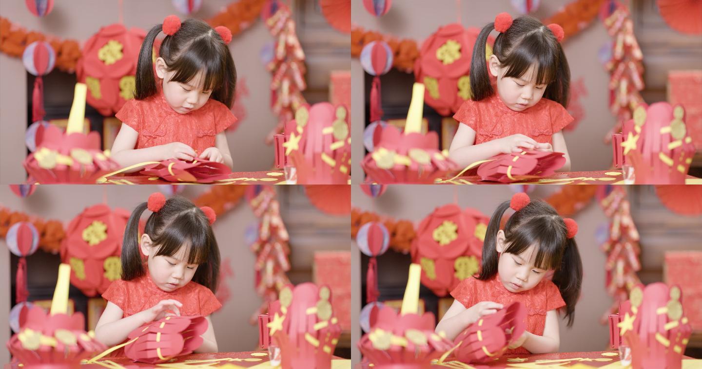 在家里制作传统中国新年工艺品的小女孩