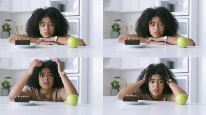 一名年轻女子决定在家里吃苹果还是巧克力布朗尼的4k视频片段