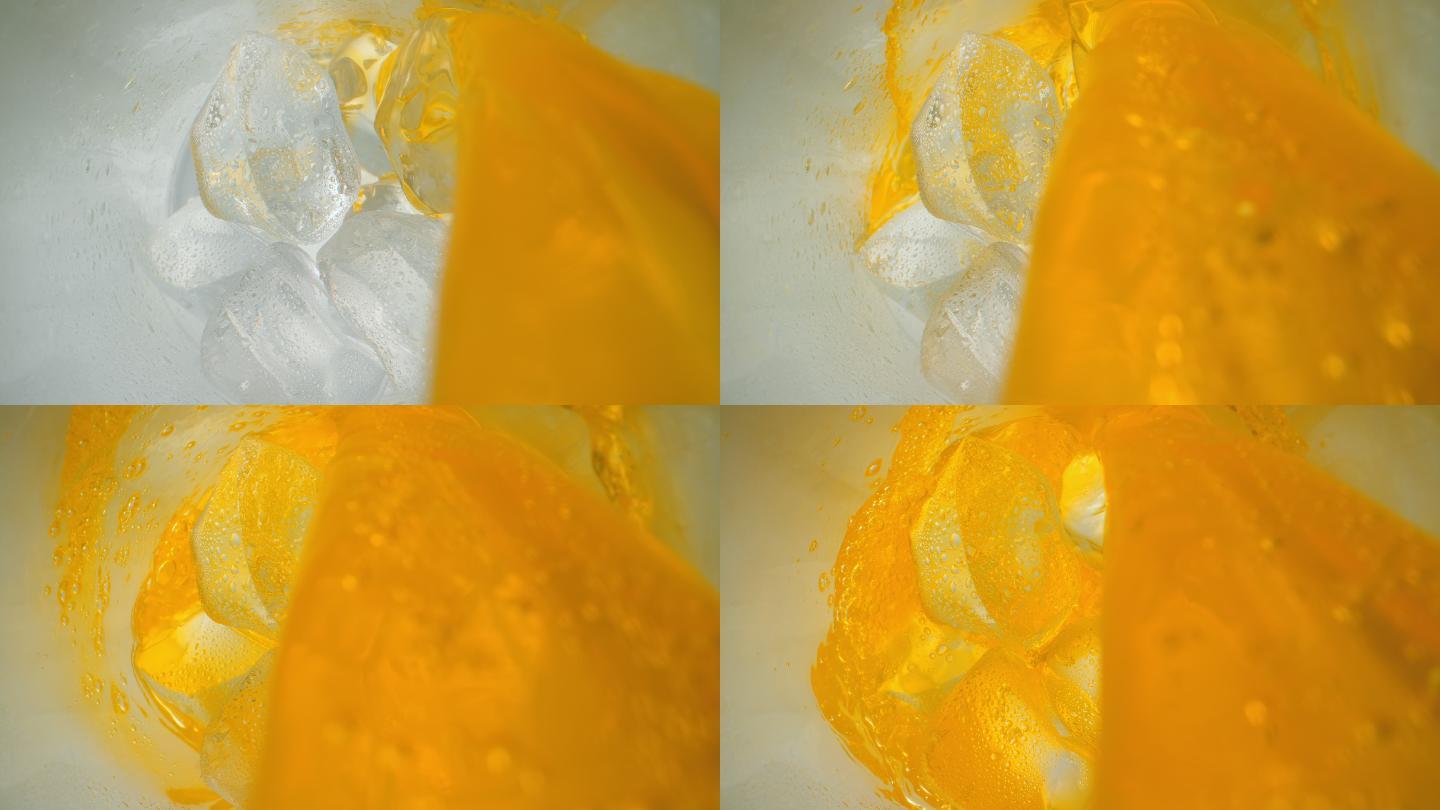 SLO MO LD橙汁软饮料流入加冰的杯子