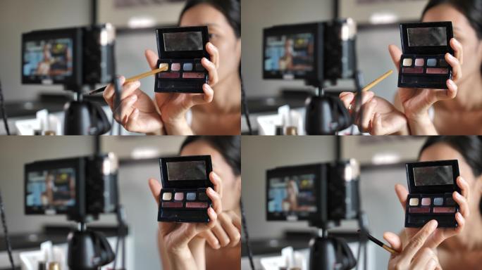 亚洲年轻女性博客作者在家里用化妆化妆品录制视频社交媒体概念的在线影响者。直播病毒
