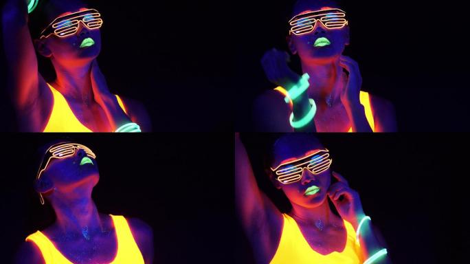 这是一段在紫外线黑光下穿着荧光服装拍摄的性感网络狂欢女的精彩视频。性感女孩cyber glow ra