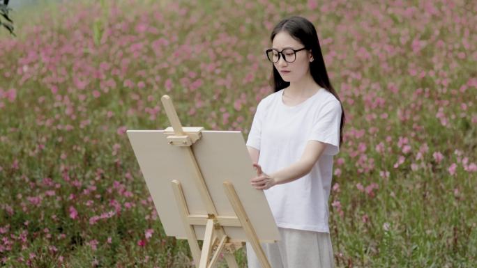 女子公园画画 花海风景如画 乡村旅游