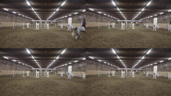 骑手穿过室内空间进行跳马训练的正面视图