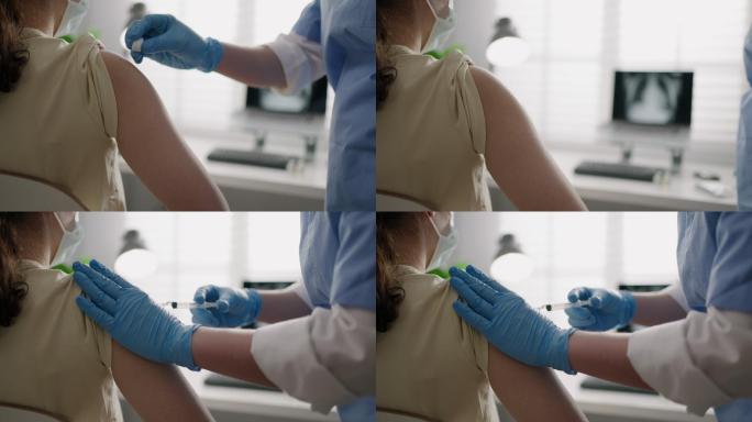 在健康诊所或医院办公室，为患者注射新冠病毒-19或流感抗病毒疫苗的女护士戴口罩，以防病毒感染