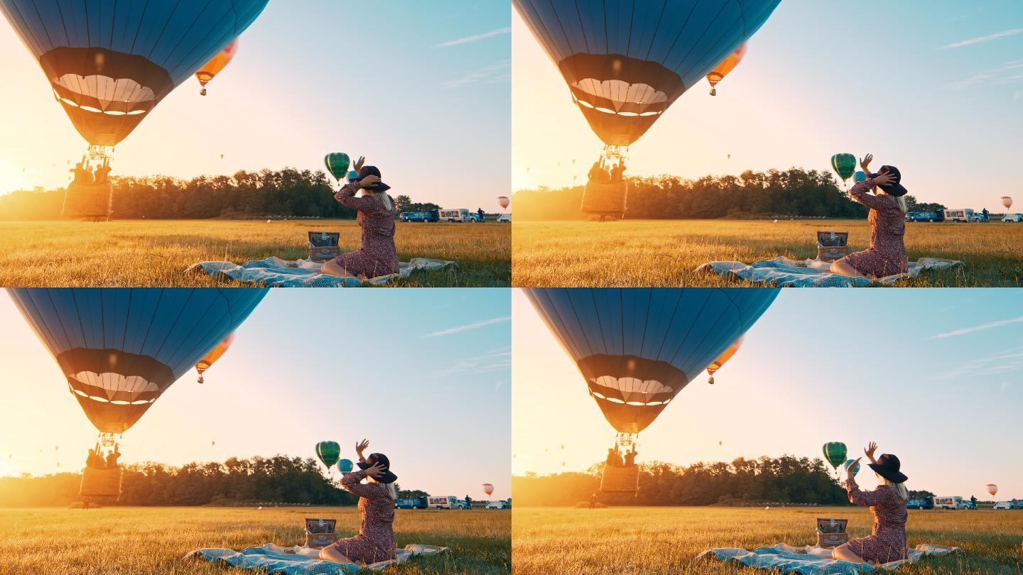 慢动作女子向热气球挥手