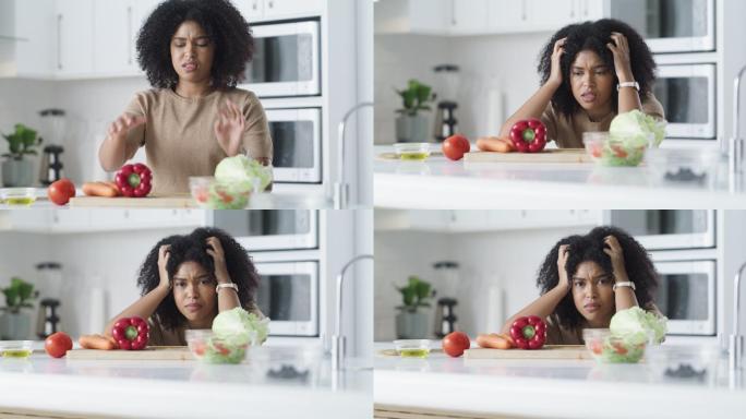 4k视频，一名年轻女子在家里做健康的饭菜时看起来很沮丧