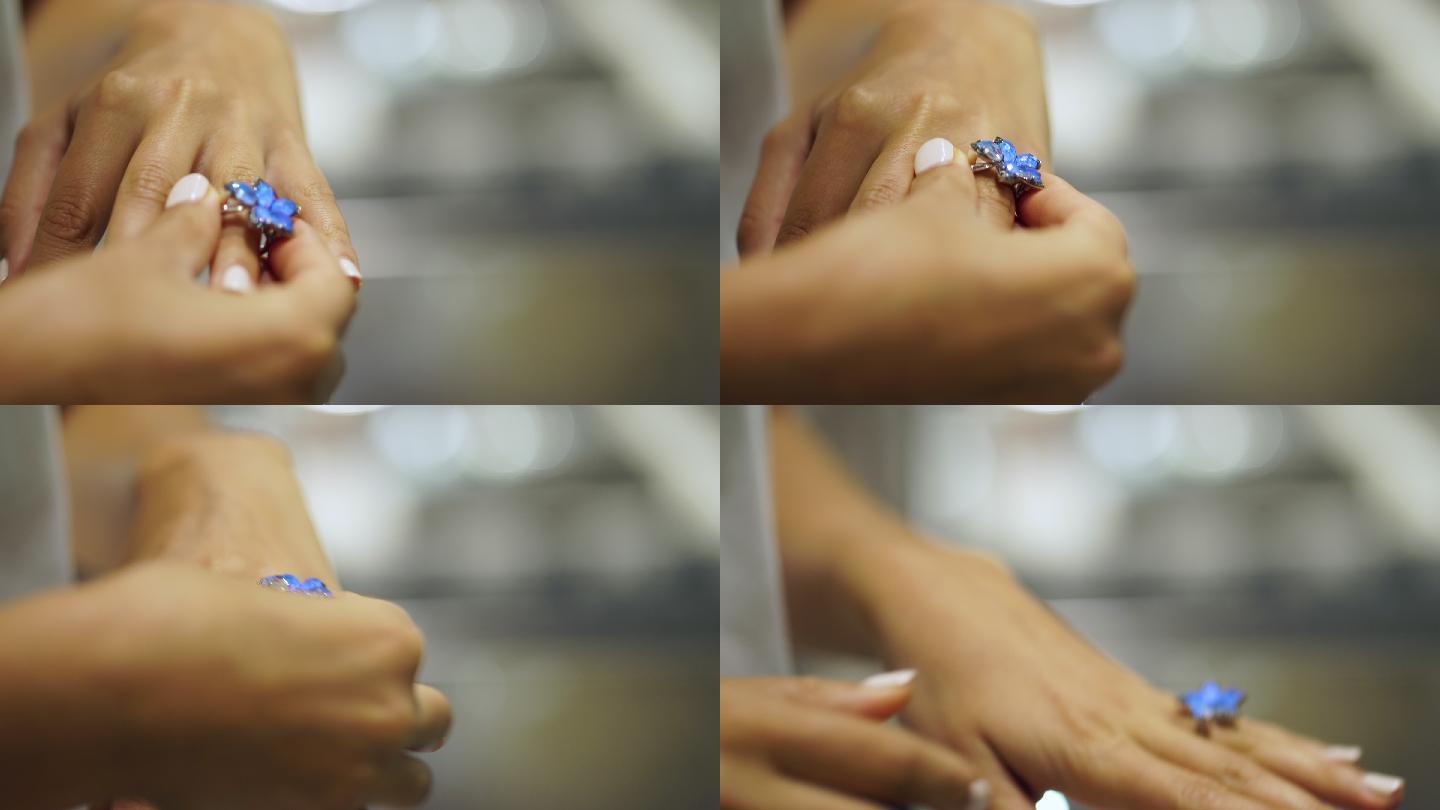 一名女子在珠宝店试戴戒指的特写镜头
