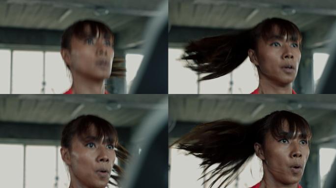 在跑步机上快速奔跑的女子的手持式照片。