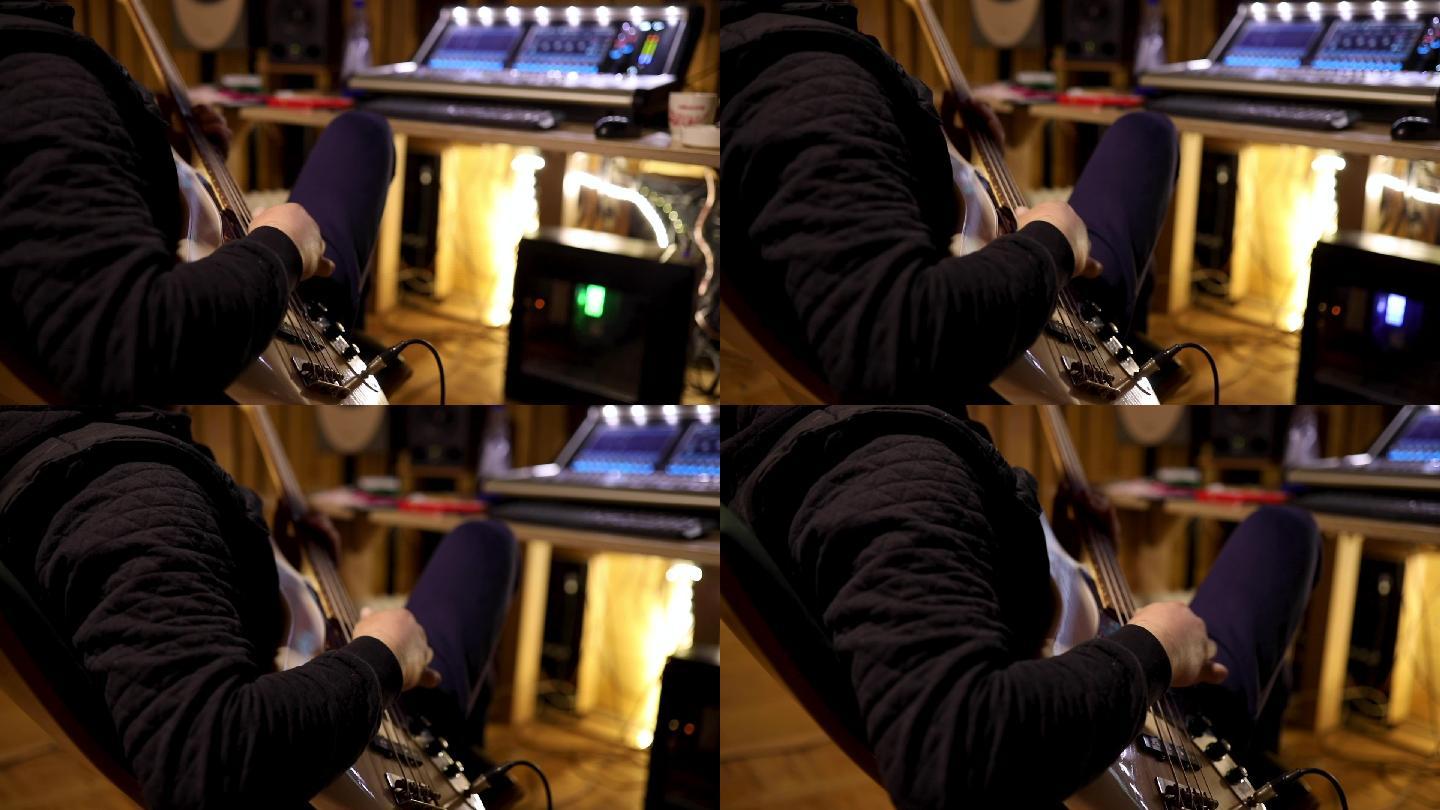 在他设备齐全的录音室里，他是男低音吉他手，独自一人弹吉他