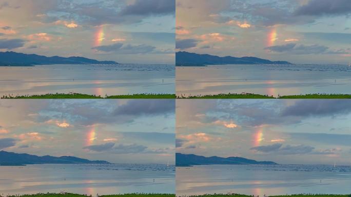 雨后海面天空出现一小段彩虹