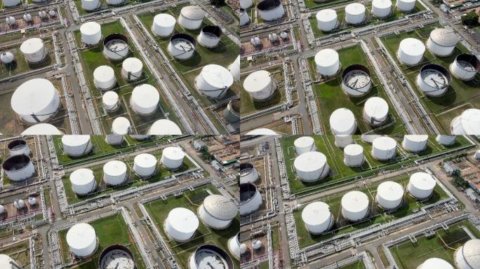 飞行的无人机POV在日出时分拍摄了东南亚石油和天然气精炼厂的石油和石化仓库工业背景