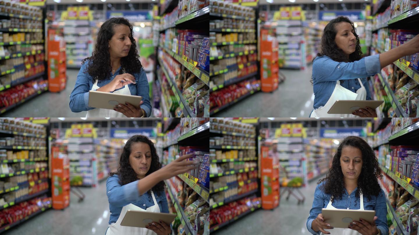 一位在超市使用数码平板电脑工作的女性肖像