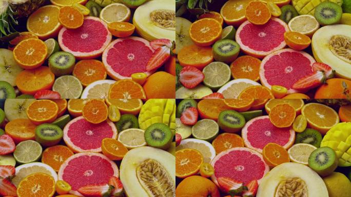 SLO MO LD柑橘与其他水果一起在盘子上旋转