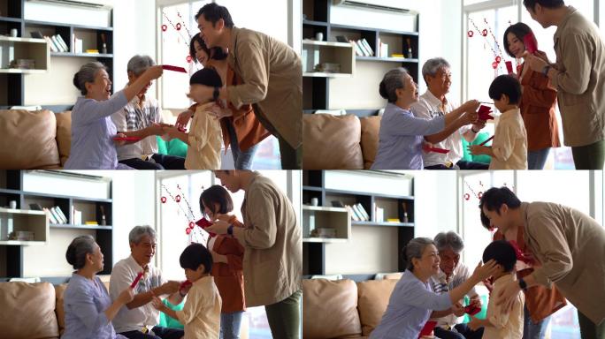 亚洲祖父母在春节期间给他们的儿子和孙子送红包