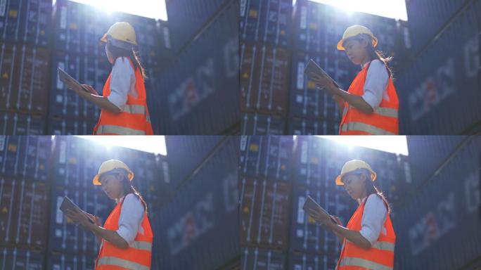 4K女工业工人在船坞使用数字平板电脑工作