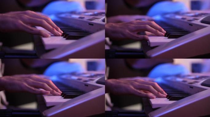 专业音乐家在录音室里演奏和即兴创作键盘的特写镜头
