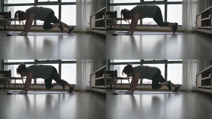 亚洲华人身体-周末在家进行积极的女子俯卧撑锻炼