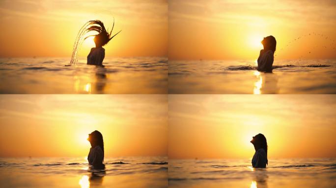 日落时在海里抛湿头发的女人