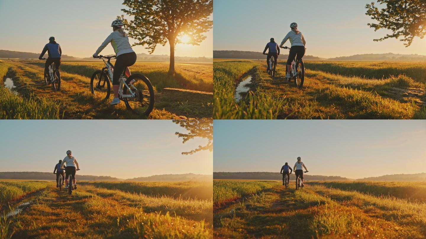 日落时分，斯洛莫夫妇在乡间骑山地自行车