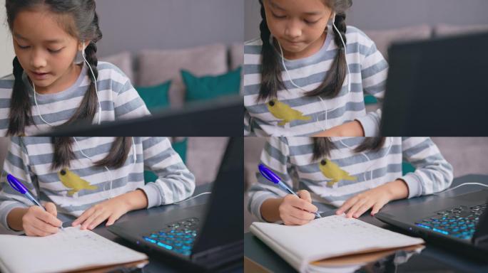 可爱的女孩在家在线学习时在书上写字