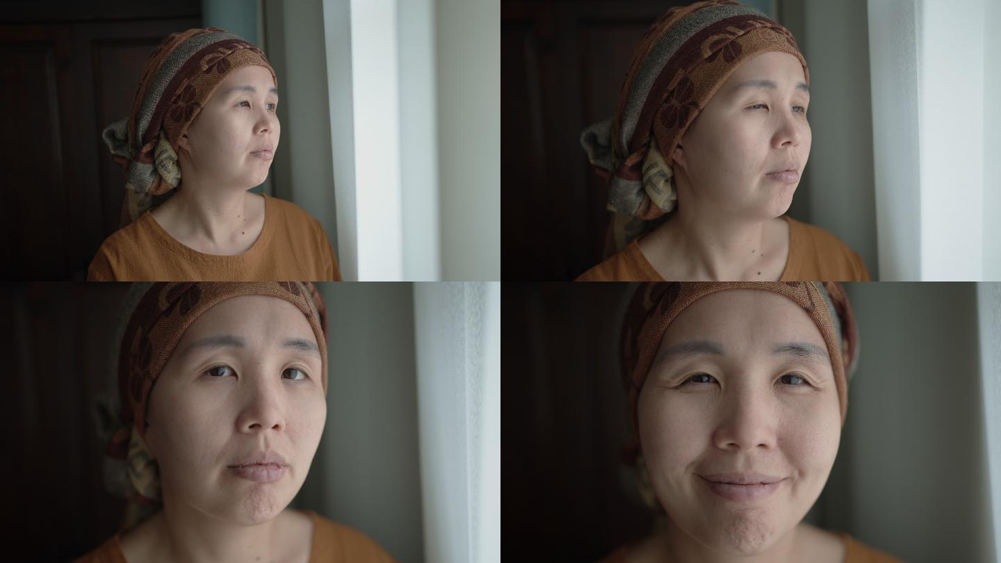 亚洲癌症女性肖像窗边的女人