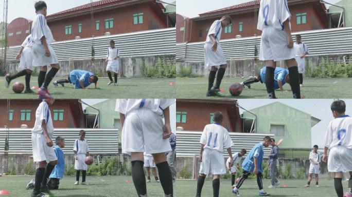 男孩在踢足球，足球运动员在比赛前正在热身。