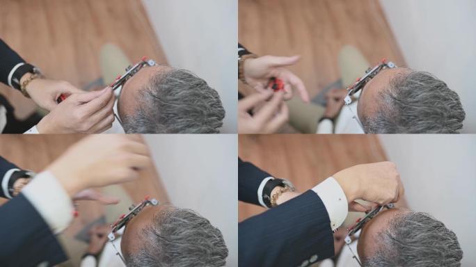正上方亚裔中国老年男性患者在眼科诊所检查视力