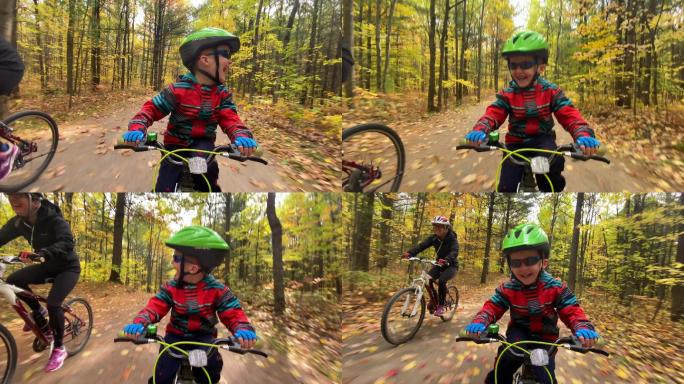 加拿大魁北克秋天，可爱的红头发小孩在森林里骑自行车