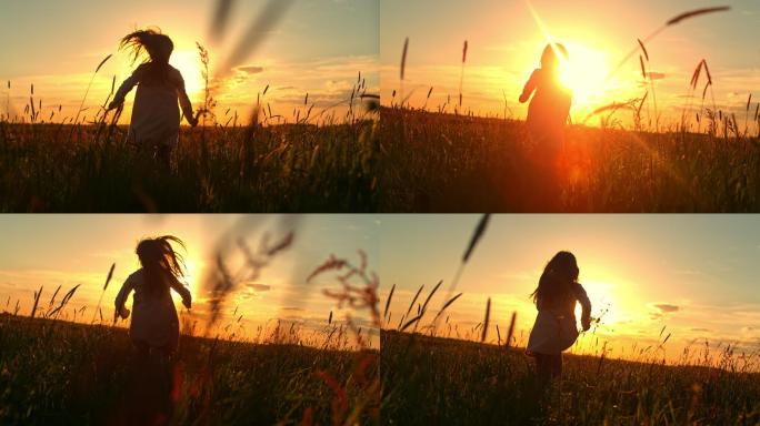 日落时分，一个小女孩在草地中央奔跑的斯洛-莫剪影