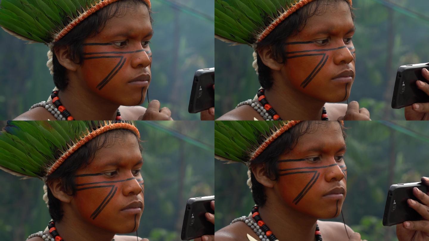 图皮瓜拉尼部落的土著男子画他的脸
