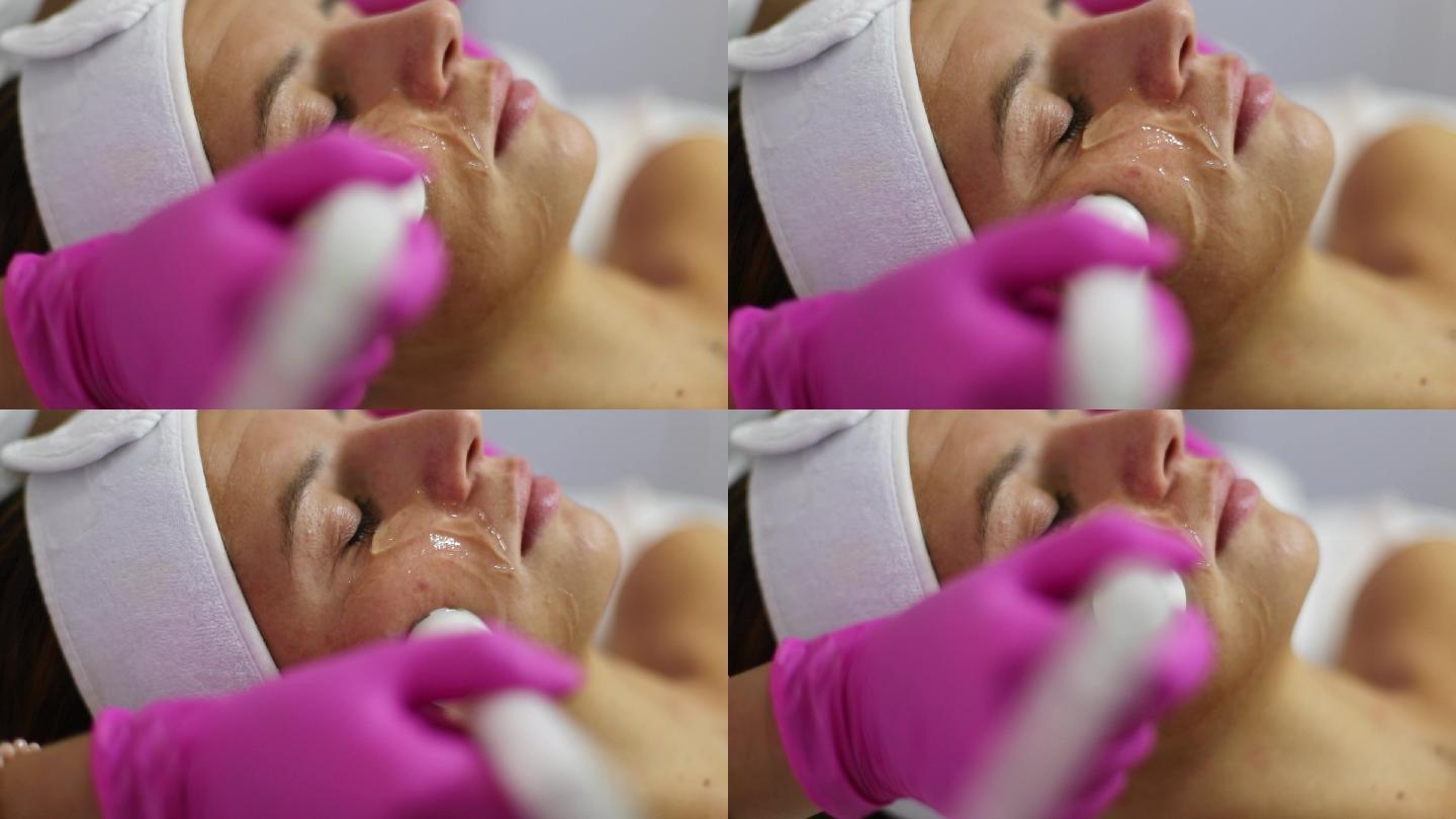 在美容院用dermapen进行面部护理。