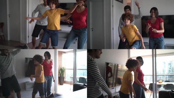 一家人一起跳舞，在家里用手机分享