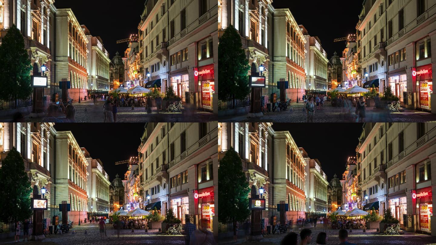 布加勒斯特夜景历史街区，交通繁忙，行人众多