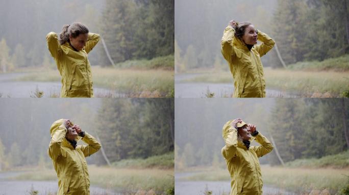 一个女人在树林里享受雨天的细节镜头
