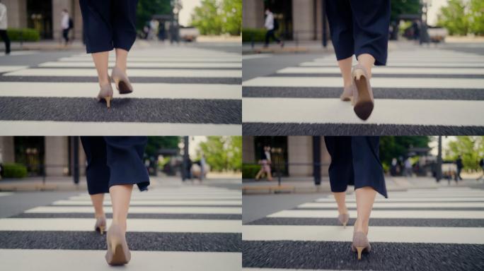 在城市过街时女商人高跟鞋的特写镜头