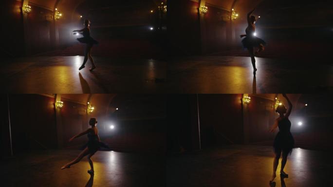 远景：一位芭蕾舞女演员在一个空荡荡的剧院的舞台上排练她的表演
