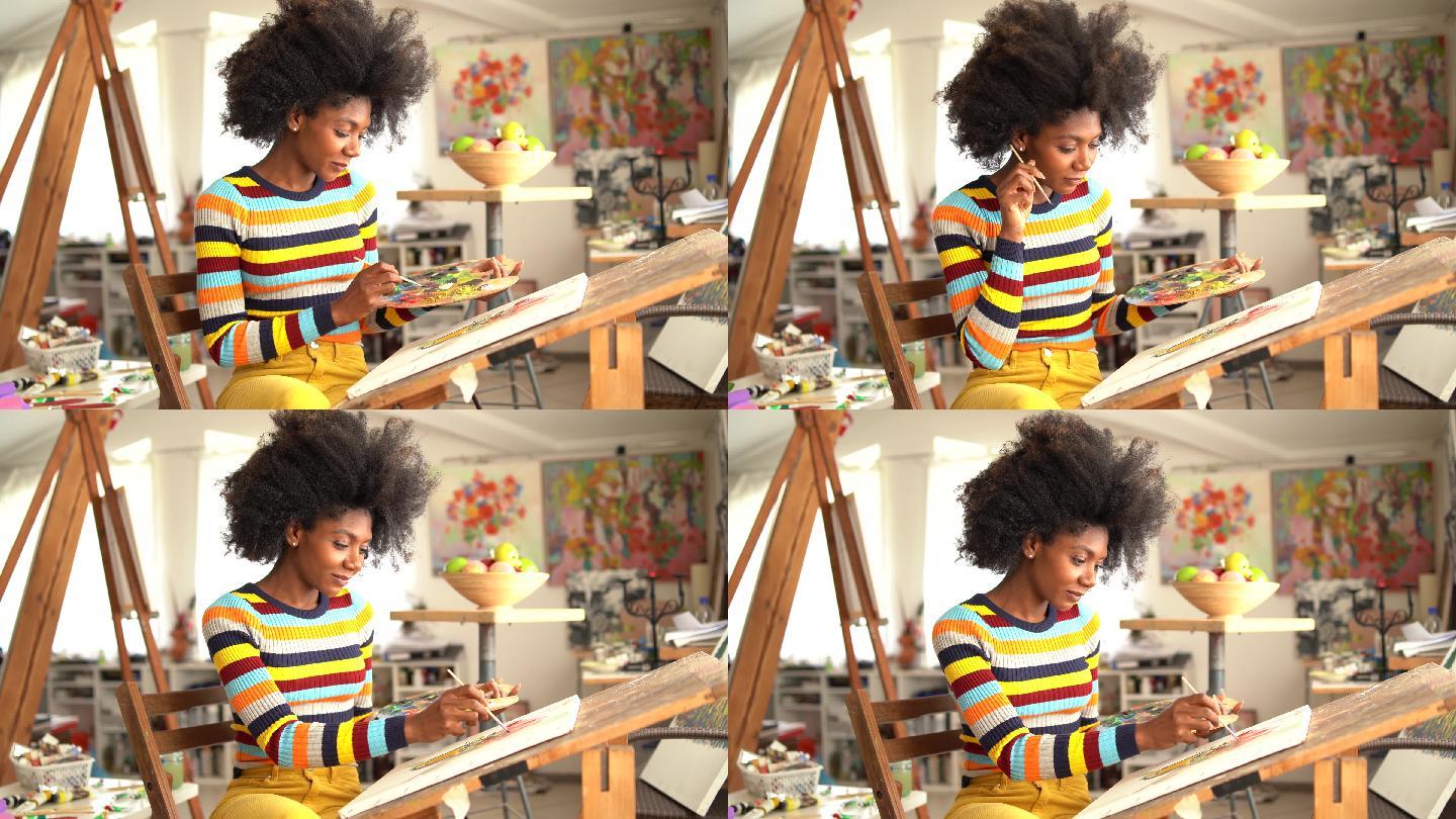 4K视频天才非裔美国年轻女画家用油画创作艺术品