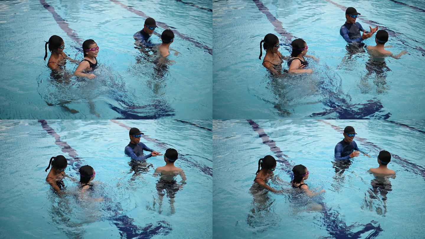 2名亚裔中国教练在游泳池里教他们的年轻学生漂浮在水面上