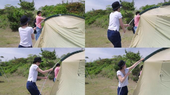日本家庭在营地搭帐篷