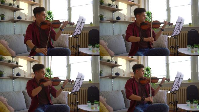 年轻的小提琴手在客厅练习小提琴