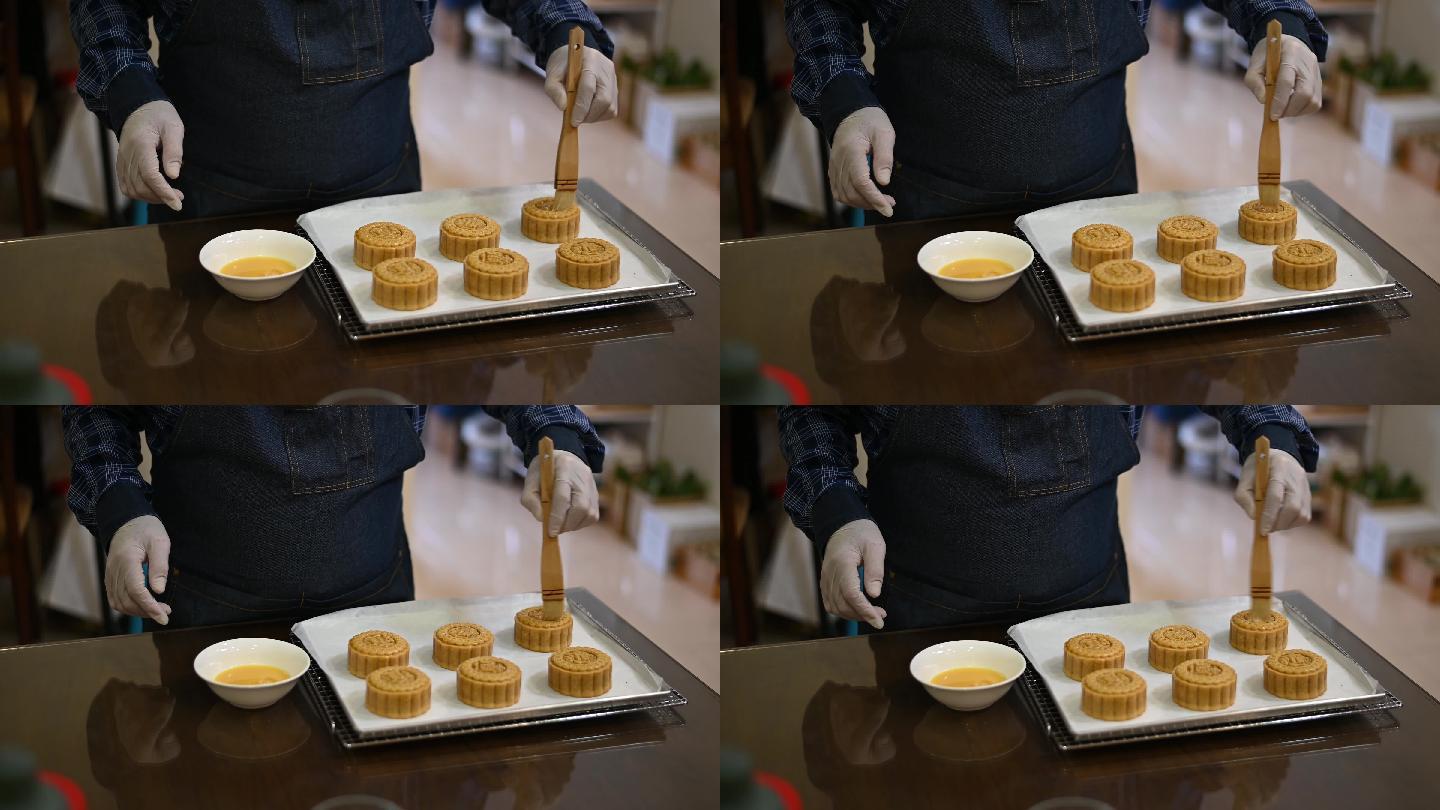 面包师用鸡蛋面团在烤盘上画自制的中国月饼