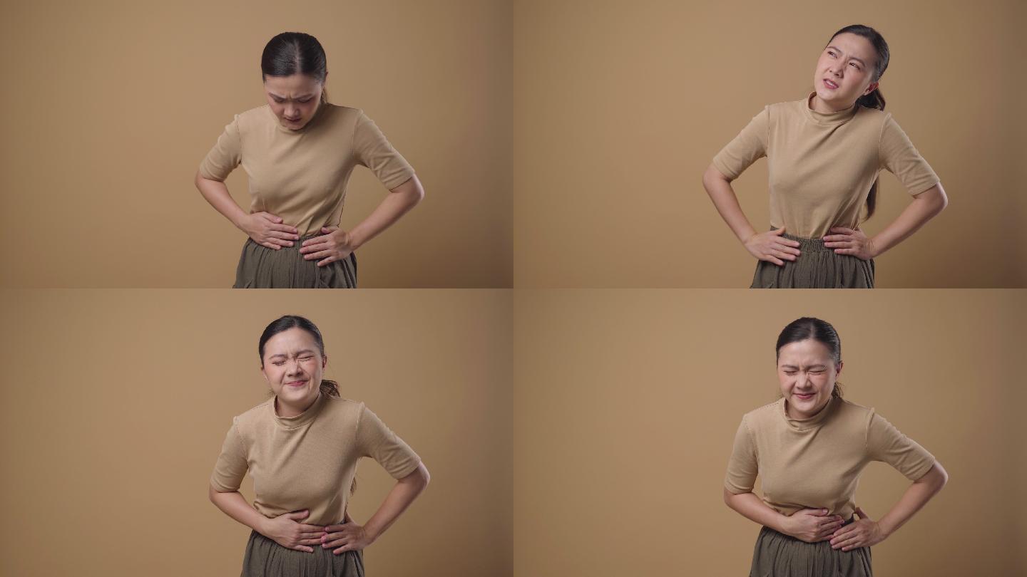 一名亚洲女性的胃痛与背景无关。4K视频