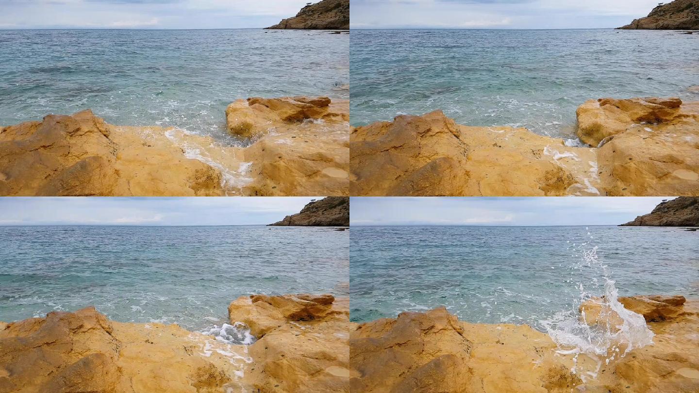 海浪拍打着黄色的石头