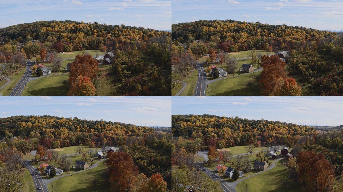 宾夕法尼亚州乡村多彩的秋天。鸟瞰Lehigh镇附近的一个小村庄，在森林覆盖的群山之间。带有平移相机运