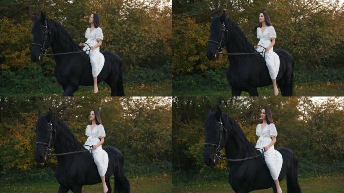 穿着白色长裙的斯洛莫年轻女子沿着森林骑马