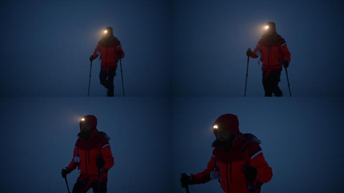 冬天雾蒙蒙的夜晚在山上徒步旅行。