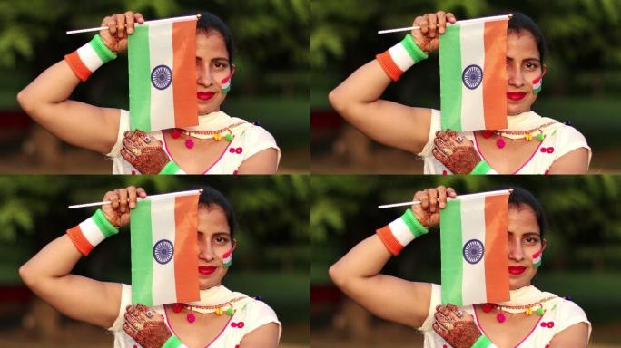 戴着印度三色旗遮住半张脸的女人