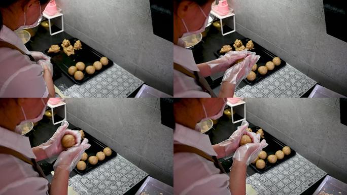 一位亚裔中国女子在家里揉着食谱的配料