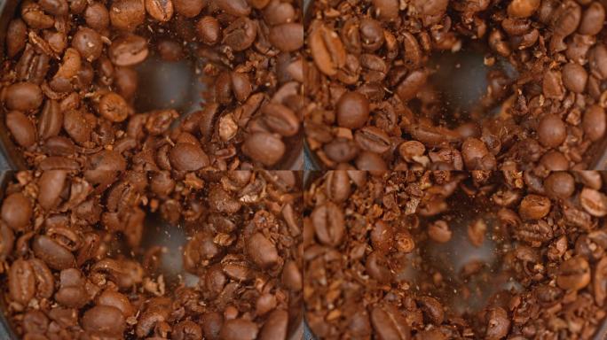 将烤好的咖啡豆放入咖啡研磨机中研磨