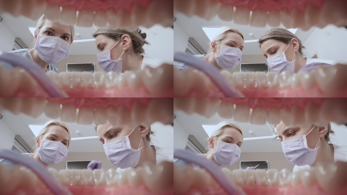 POV助手在牙医开始对牙齿进行治疗前，将吸管放入患者口腔